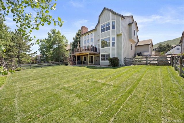 10 Sand Cherry, Littleton, CO 80127 - back of house with a deck, stairway, and a chimney