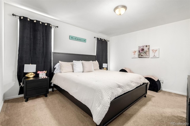 933 W Independent Ave, La Salle, CO 80645 - bedroom with baseboards and light carpet