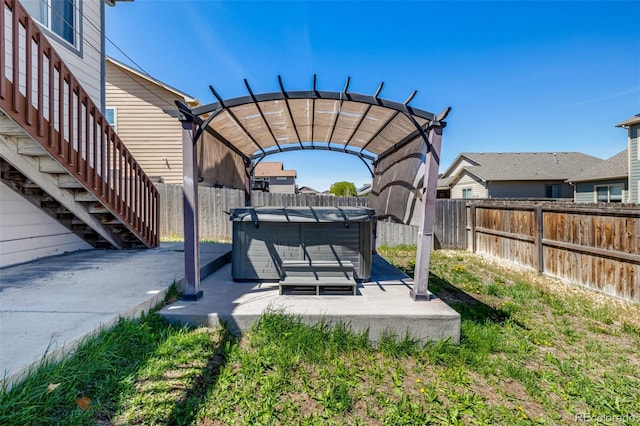 933 W Independent Ave, La Salle, CO 80645 - exterior space with a fenced backyard, a hot tub, and a pergola