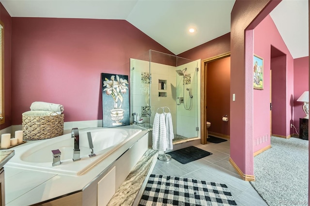 6588 S Oak Cir, Littleton, CO 80127 - bathroom with a stall shower, vaulted ceiling, a garden tub, and tile patterned floors