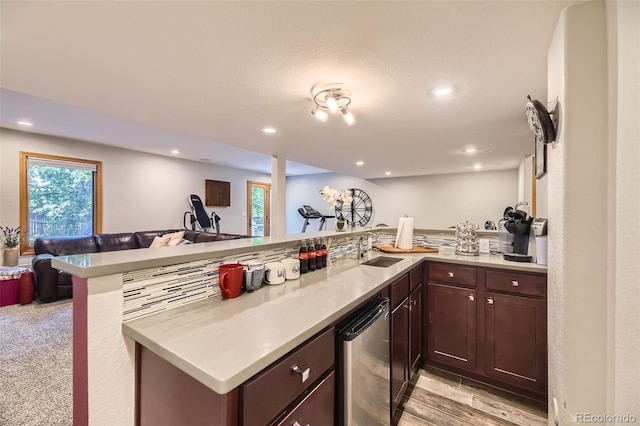 6588 S Oak Cir, Littleton, CO 80127 - kitchen featuring open floor plan, dark brown cabinetry, light countertops, refrigerator, and recessed lighting