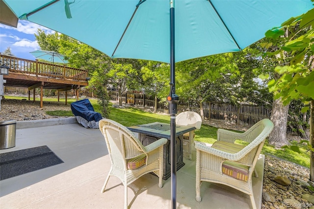 6588 S Oak Cir, Littleton, CO 80127 - fenced backyard with a deck and a patio area
