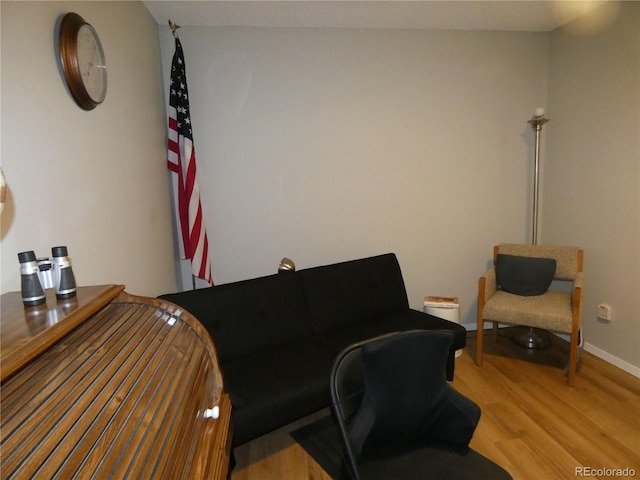 interior space featuring light wood-style flooring and baseboards