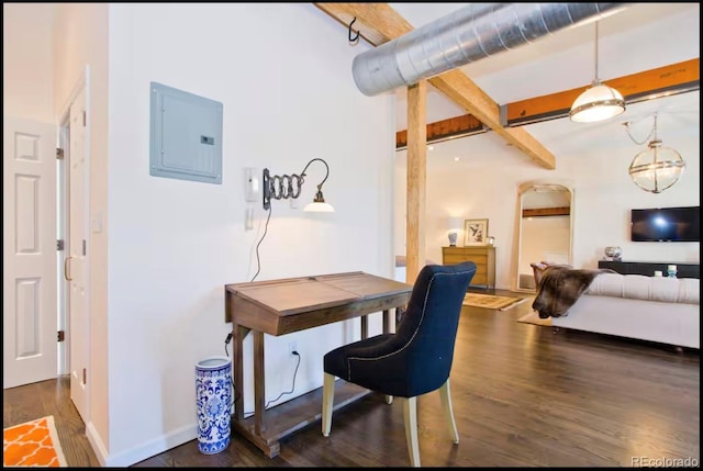 office space featuring baseboards, electric panel, beam ceiling, and wood finished floors