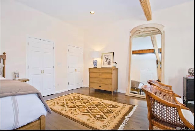 bedroom featuring recessed lighting, beamed ceiling, and wood finished floors