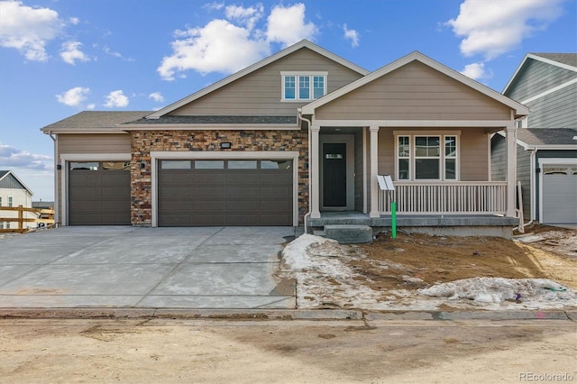 view of front of house featuring a garage and covered porch