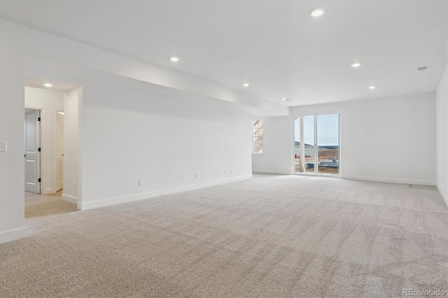 unfurnished room with light colored carpet