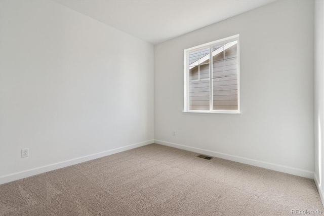 view of carpeted spare room