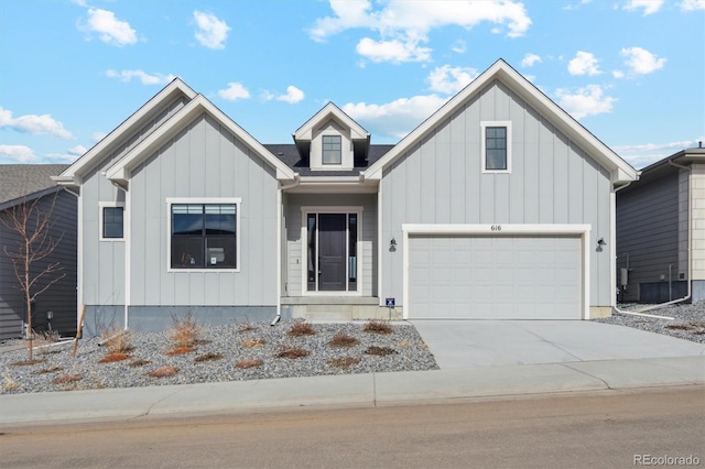 modern inspired farmhouse featuring concrete driveway, a garage, and board and batten siding