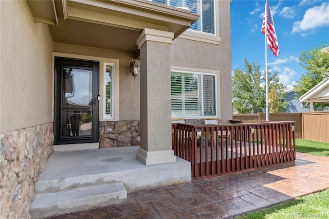 9169 Fox Fire Way, Highlands Ranch, CO 80129 - doorway to property featuring stucco siding and stone siding