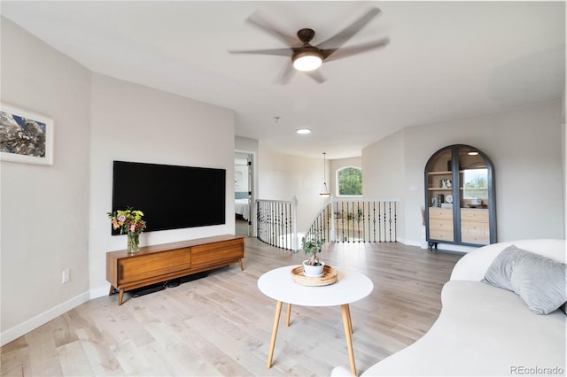 9169 Fox Fire Way, Highlands Ranch, CO 80129 - living area with a ceiling fan, wood finished floors, baseboards, and recessed lighting