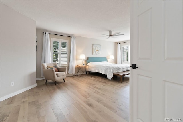9169 Fox Fire Way, Highlands Ranch, CO 80129 - bedroom with light wood-style floors, baseboards, and ceiling fan
