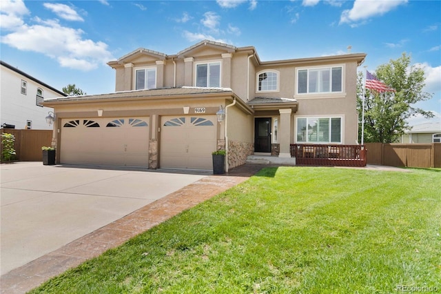 9169 Fox Fire Way, Highlands Ranch, CO 80129 - view of front of property featuring driveway, stucco siding, a garage, and a tile roof
