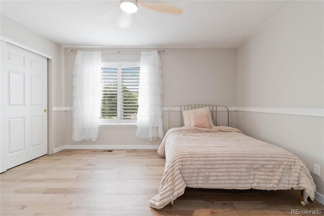 9169 Fox Fire Way, Highlands Ranch, CO 80129 - bedroom with wood finished floors, baseboards, and a ceiling fan