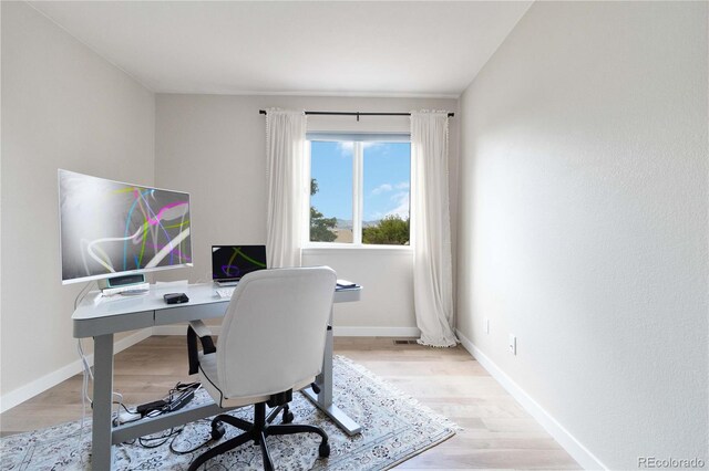 9169 Fox Fire Way, Highlands Ranch, CO 80129 - home office with wood finished floors and baseboards
