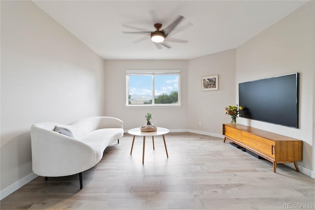 9169 Fox Fire Way, Highlands Ranch, CO 80129 - sitting room featuring baseboards and light wood-style flooring