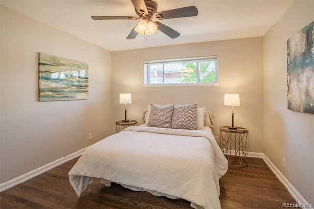 bedroom with dark wood-style floors, ceiling fan, and baseboards