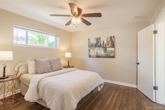 bedroom featuring dark wood-style floors, ceiling fan, and baseboards