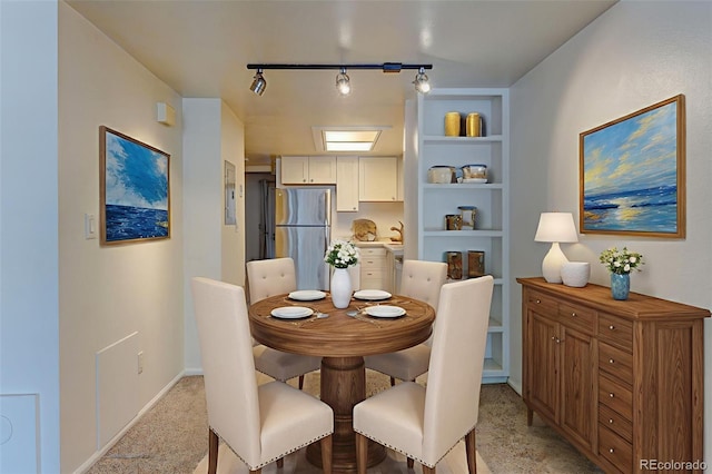 1885 S Quebec Way Unit A16, Denver, CO 80231 - dining area with light carpet and built in shelves