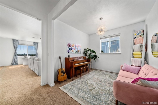 12972 Uinta Ct, Thornton, CO 80602 - living area featuring carpet, a chandelier, and baseboards