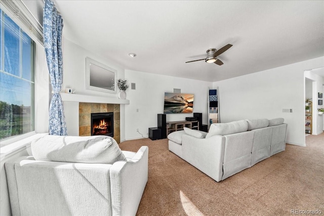 12972 Uinta Ct, Thornton, CO 80602 - living area with light carpet, a tile fireplace, and a ceiling fan