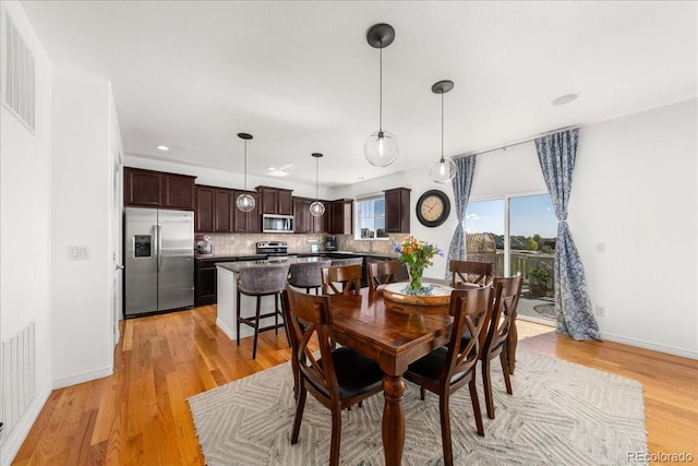 12972 Uinta Ct, Thornton, CO 80602 - dining room with light wood finished floors, baseboards, and recessed lighting