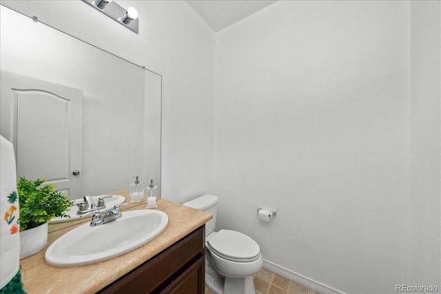 12972 Uinta Ct, Thornton, CO 80602 - half bathroom featuring vanity, toilet, and baseboards