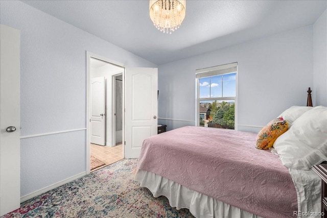 12972 Uinta Ct, Thornton, CO 80602 - bedroom featuring a chandelier, baseboards, and vaulted ceiling