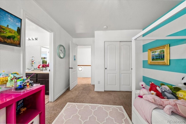 12972 Uinta Ct, Thornton, CO 80602 - bedroom featuring light colored carpet, a closet, baseboards, and connected bathroom