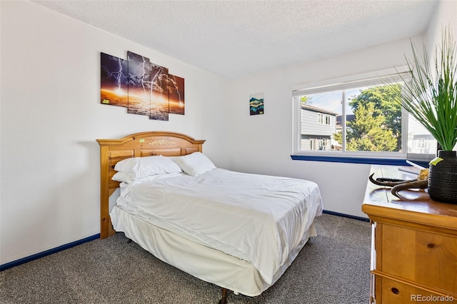 9805 Garrison Ct, Broomfield, CO 80021 - carpeted bedroom featuring a textured ceiling and baseboards