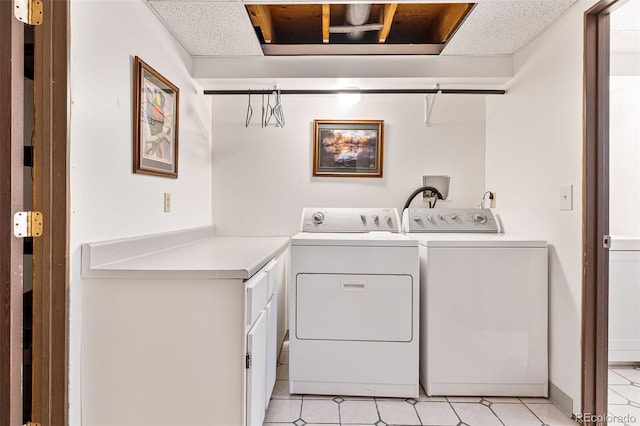 9805 Garrison Ct, Broomfield, CO 80021 - washroom with washer and clothes dryer and light tile patterned floors