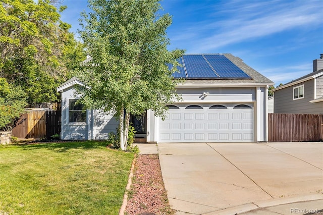 9805 Garrison Ct, Broomfield, CO 80021 - view of front of home featuring roof mounted solar panels, driveway, and a garage