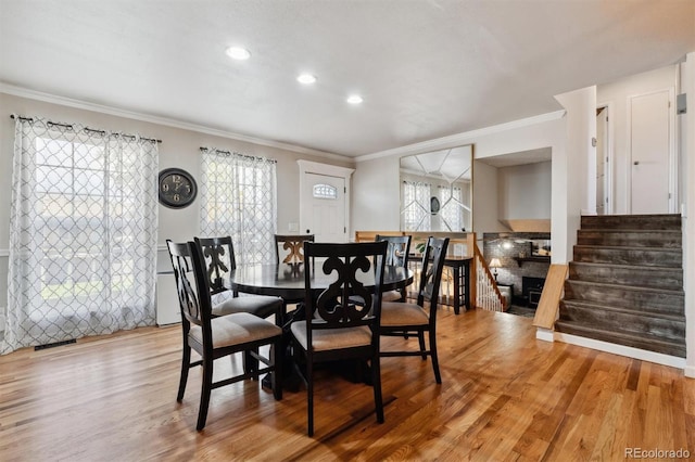 dining room featuring ornamental molding and hardwood / wood-style flooring