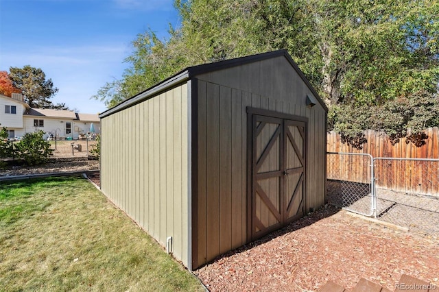 view of outbuilding featuring a lawn