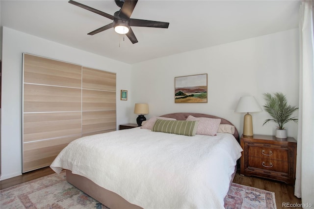 bedroom featuring ceiling fan and wood finished floors