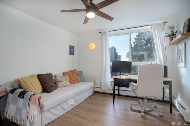 office area featuring ceiling fan, light hardwood / wood-style flooring, and baseboard heating