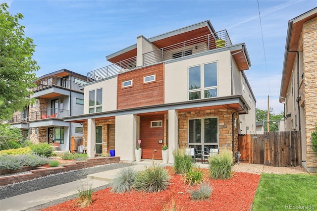 4156 Vrain St, Denver, CO 80212 - contemporary house with stone siding, a balcony, stucco siding, and covered porch