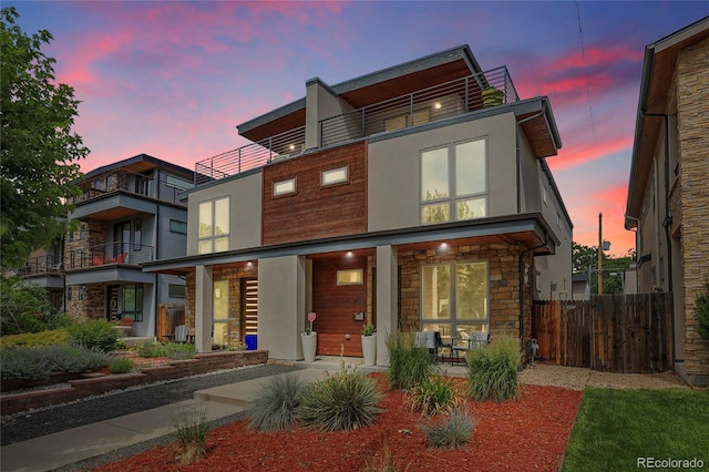 4156 Vrain St, Denver, CO 80212 - contemporary home with stone siding, stucco siding, covered porch, and a balcony