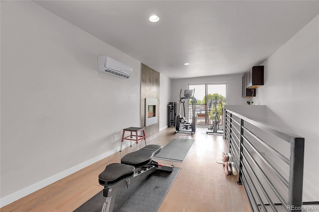4156 Vrain St, Denver, CO 80212 - workout room with an AC wall unit, light wood-type flooring, and recessed lighting