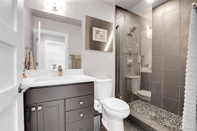 4156 Vrain St, Denver, CO 80212 - bathroom featuring a tile shower, vanity, and tile patterned flooring