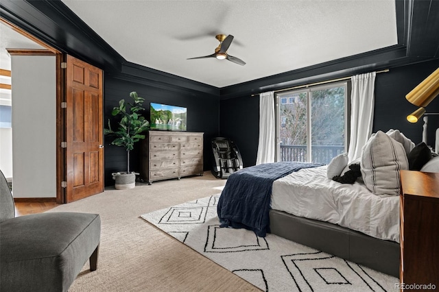 carpeted bedroom with ornamental molding and a ceiling fan