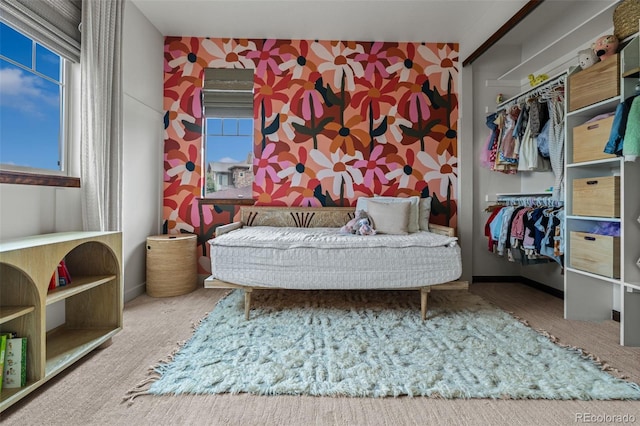 bedroom featuring a closet and baseboards