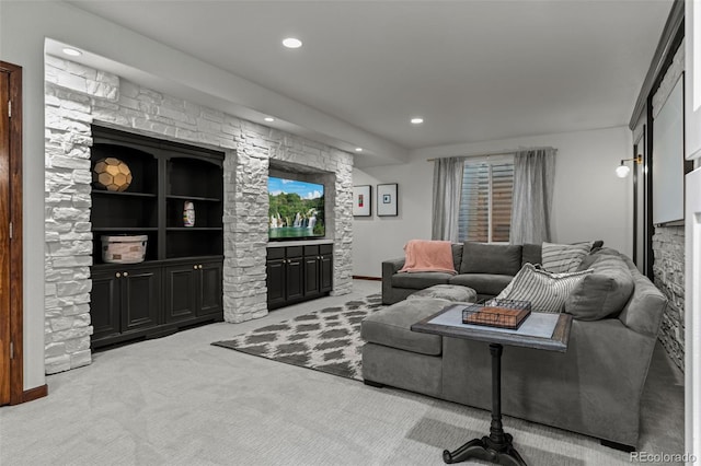 living area with light carpet and recessed lighting