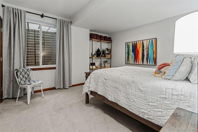 carpeted bedroom with baseboards