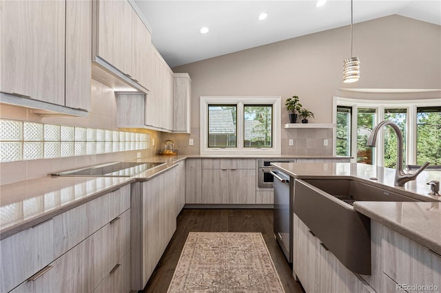 kitchen featuring a sink, modern cabinets, decorative backsplash, appliances with stainless steel finishes, and recessed lighting