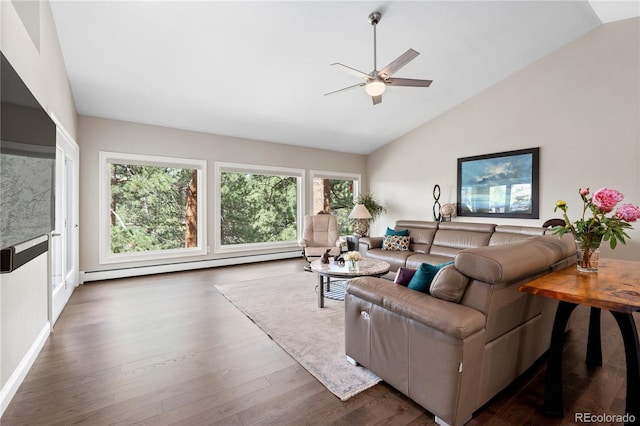 living room featuring a ceiling fan, baseboard heating, dark wood-style flooring, baseboards, and high vaulted ceiling