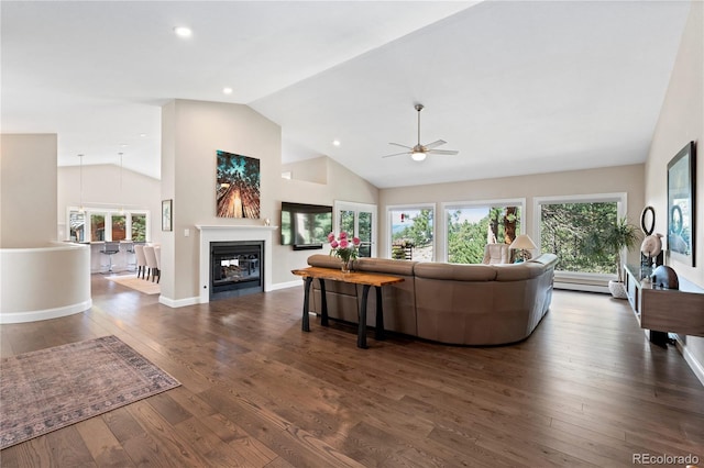 living room featuring ceiling fan, wood finished floors, a glass covered fireplace, recessed lighting, and high vaulted ceiling