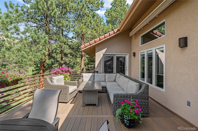 wooden deck featuring outdoor lounge area