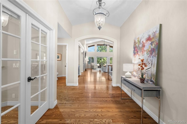 11 Canon Pl, Greenwood Village, CO 80111 - entryway with arched walkways, french doors, wood finished floors, and lofted ceiling