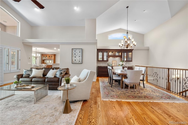 11 Canon Pl, Greenwood Village, CO 80111 - living room with a chandelier, wood finished floors, a ceiling fan, and high vaulted ceiling